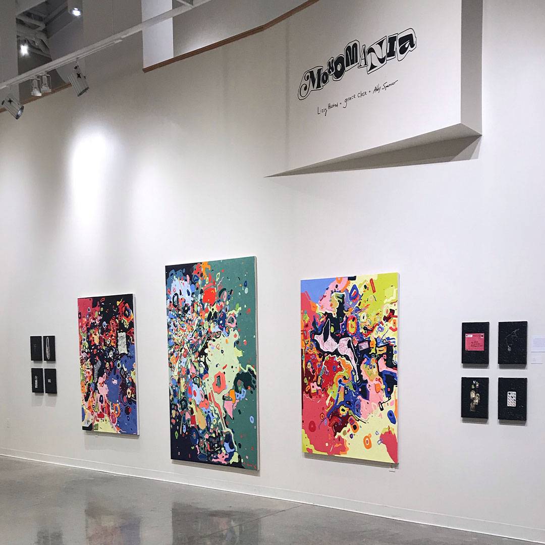 Image of BFA Exhibition "Monomania" which shows Abby Spencers work primarily, which was primarily large-scale colorful paintings.